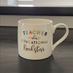 a white coffee mug with teacher appreciation written on it