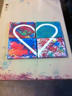 two pieces of art that have been painted on top of each other with the shape of a heart