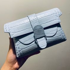 An Upgraded Version Of The Classic Fanny Pack. Features 3 Interior Pockets That Can Fit Up To An Iphone 11 Plus. Wear It As A Belt Bag, A Sling Bag, A Crossbody, Or A Clutch. Patented For Design And Utility. Want Even More Ways To Wear? Swap In A Metal Chain Strap For An Elegant Upgrade. Details Made In Italy 100% Genuine Italian Leather That Is Scratch, Stain, And Water Resistant Supple, Stain-Resistant Micro-Suede Interior Patented For Design And Utility Secured By A Flap Closure With A Magnet Classic Light Blue Shoulder Bag For Formal Occasions, Luxury Light Blue Shoulder Bag For Formal Occasions, Elegant Blue Crossbody Clutch, Light Blue Rectangular Shoulder Bag For Formal Occasions, Designer Light Blue Shoulder Bag For Evening, Light Blue Formal Crossbody Shoulder Bag, Formal Light Blue Crossbody Shoulder Bag, Light Blue Evening Shoulder Bag, Formal Light Blue Shoulder Bag