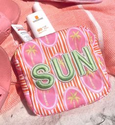 the cutest pink palm sun mini yet! This pink palm print is the perfect bag to hold your sunglasses, chapsticks, phone, and more! Patches sewn on Beautiful artwork in collaboration with Fete Papier! Dimensions: 10 x 3 x 5.5 inches Pink Beach Bag With Zipper Pouch, Casual Pink Poolside Bag, Pink Vacation Bag With Zipper Pouch, Fun Pink Vacation Bag, Summer Vacation Bags With Zipper Pouch, Summer Vacation Bag With Zipper Pouch, Pink Palm Tree, Clear Pouch, Swim Bag