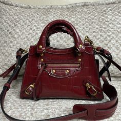 Brand New, Comes With Dust Bag But No Box Please Be Aware Of That Family & Friends Sales Doesn’t Have Standard Packaging. Color : Burgundy Dimensions : L8,6 X H5,5 X W4,3 Inch Embossed Calfskin Two Leather Hand-Braided Handles Adjustable And Removable Leather Strap Zipped Closure With Knotted Leather Puller Tone-On-Tone Logo Embossed On Front Front Zipped Pocket With Knotted Leather Puller 1 Inner Flat Pocket Nappa Lambskin Bonded Lining Made In Italy Wipe With A Soft Cloth Free Authentication F Designer Burgundy Top Handle Shoulder Bag, Designer Burgundy Shoulder Bag With Branded Hardware, Designer Burgundy Bag With Top Carry Handle, Designer Burgundy Bags With Top Carry Handle, Designer Burgundy Rectangular Shoulder Bag, Luxury Burgundy Shoulder Bag With Branded Hardware, Designer Burgundy Crossbody Satchel, Designer Burgundy Shoulder Bag For Shopping, Designer Burgundy Shoulder Bag With Double Handle