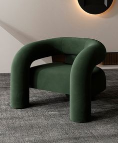 a green chair sitting on top of a carpeted floor next to a wall mounted clock