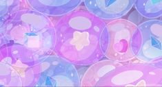 many bubbles are floating in the air with blue, pink and purple colors on them