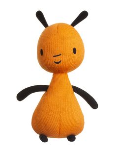 an orange stuffed animal with black legs