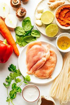 the ingredients are laid out on the table to be prepared for this meal, including meats and vegetables