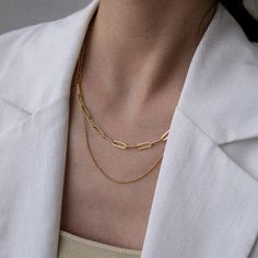 "A simple but dainty necklace from the Paperclip Chain Collection. Twice is nice. This necklace can take your layering game to another level. Available in two colors. You can't wear them separately. - Materials: 18K gold plated titanium - Color: gold and silver - Length: the shorter necklace is approximately 15.7\" / 39cm. The longer one is approximately 16.5\" / 43cm. The extender is about 2.3\" / 6cm - The product is tarnish-resistant and hypoallergenic Q&A 1. What is the material? - It is Minimalist Paperclip Chain Necklace, Minimalist Double Chain Link Necklace, Minimalist Everyday Charm Necklace With Double Chain, Minimalist Everyday Layered Chain Necklace, Minimalist Layered Link Chain Necklace, Minimalist Everyday Layered Chain Link Necklace, Minimalist Double Chain Necklace, Double Chain Paperclip Necklace For Gift, Paperclip Double Chain Necklace For Gift