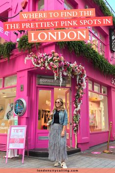 a woman standing in front of a pink building with the words where to find the prettiest pink spots in london