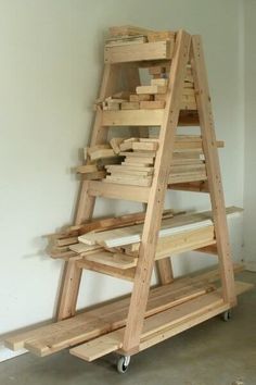 a large wooden shelf sitting on top of a floor next to a white wall in a room