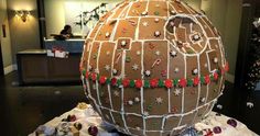 a giant decorated egg sitting on top of wrapping paper