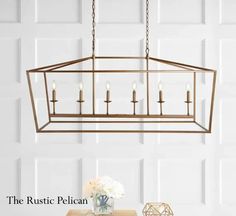 the rustic pelican chandelier is made from metal and features five candles