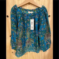 Peek Blouse Nwt Size 6-7. Turquoise Flowy Blouse. Turquoise Long Sleeve Top For Summer, Casual Printed Turquoise Tops, Casual Long Sleeve Turquoise Blouse, Casual Turquoise Long Sleeve Blouse, Casual Turquoise Printed Top, Flowy Peasant V-neck Blouse, Turquoise Long Sleeve Cotton Top, Multicolor Non-stretch Bohemian Blouse, V-neck Peasant Top With Boho Print