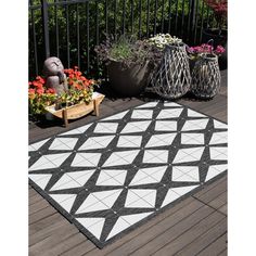 Are you on the hunt for an outdoor area rug? Look no further than our Outdoor Collection. From runners to octagons, our Outdoor Collection has all kinds of shapes and sizes. Colors too! Abstract, country, striped, or even vintage, our Outdoor Collection's got you covered. This collection can take care of any outdoor wants and needs. Black And White Area Rug, Vinyl Chairs, Diamond Trellis, Area Rug Pad, Wants And Needs, Kinds Of Shapes, Indoor Carpet, Target Rug, Stripe Throw Pillow