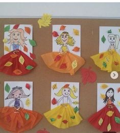 a bulletin board with paper dolls and leaves on it