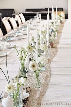 a long table with white flowers and candles on it is shown in an instagram