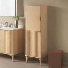 a bathroom with two wooden cabinets next to a sink