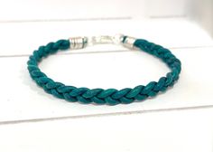 "HAND BRAIDED TEAL LEATHER BRACELET-  CUSTOM SIZES 2mm Teal/Turquoise leather is hand-braided and finished with silver, brass, gold or copper lobster clasp. Perfect as a minimalist piece on its own, or layered with other bracelets. A versatile and unisex piece of jewelry which can be made in lengths to use as a bracelet of anklet. The color noted on the leather spool is \"turquoise\" but it looks to be more of a teal color to me which is why I listed it as such. ~~MADE TO ORDER~~ Please select s Boho Leather Bracelet, Leather Anklets, Boho Beautiful, Teal Leather, Beachy Boho, Bracelet Minimalist, Turquoise Leather, Teal Turquoise, Unisex Gift