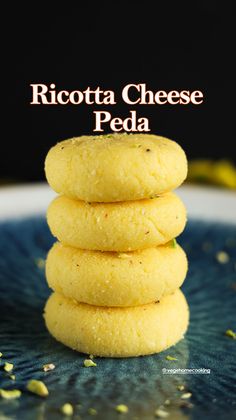 ricotta cheese peda stacked on top of each other in front of a black background