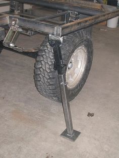 a large metal cart with two wheels on it