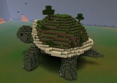 an image of a turtle made out of some sort of rocks and grass with trees on top