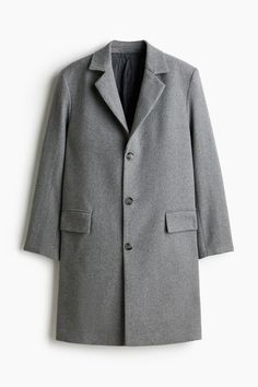 Single-breasted coat in a felted wool blend. Notched lapels and buttons at front. Front pockets with flap  welt inner pockets  and vent at back. Lined. Gray Wool Single-breasted Outerwear, Business Wool Long Coat With Pockets, Business Long Wool Coat With Pockets, Classic Gray Wool Coat With Pockets, Classic Long Wool Coat With Single Button, Classic Single Button Long Wool Coat, Gray Outerwear With Concealed Placket For Work, Classic Wool Coat With Single Button And Notch Lapel, Gray Wool Coat With Lapel Collar And Button Closure