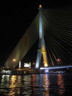 the bridge is lit up at night time