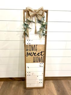 a wooden sign that says home sweet home