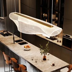 a modern kitchen with marble counter tops and an overhead light fixture over the island area