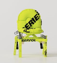 a yellow chair that has been placed on top of a step stool with the word repol printed on it