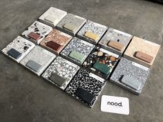 there are many different kind of cases on the floor next to a sign that says nood