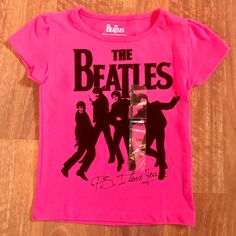 a pink shirt with the beatles on it