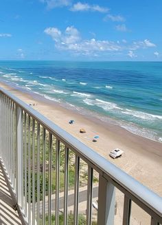 an ocean view from a balcony overlooking the beach