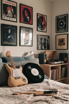 a bedroom with guitars and records on the wall