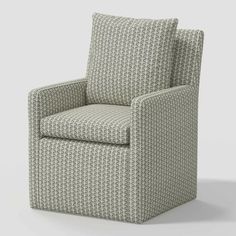 an upholstered chair with grey and white patterned fabric