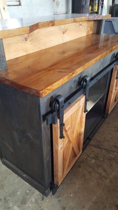 a large wooden counter top sitting inside of a building