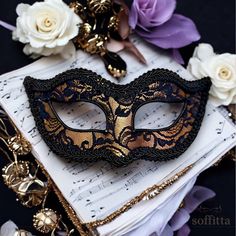 Venetian style masquerade mask covered black lace on metallic gold surface. Framed with black braided trim, small black rhinestones on the corners of the eyes. Your order will be delivered with online tracking by UPS or FedEx.  Back surface is also covered with fabric for comfortable use. Ribbons are added both sides to tie. Base mask is made of paper mache.  Standard size fits most (for women). This classical Venetian mask is perfect for any costume or Halloween party, masquerade, carnival, wedding, prom. I recreate this design after each sale. Since it's totally handmade, the mask you will receive may vary slightly from the one seen in the photo. Also please note that color tones may look slightly different depending on your monitor settings.  For all items on Soffitta: www.etsy.com/shop Masquerade Black And Gold, Lace Masquerade Mask, Lace Masquerade Masks, Mask Ball, Masquerade Carnival, Masquerade Ball Mask, Venetian Masquerade Masks, Ball Mask, Venetian Masquerade