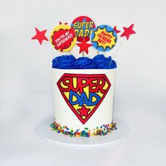 a birthday cake that is shaped like a super dad