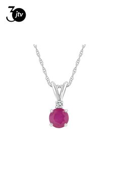 5mm round ruby with diamond accent rhodium over 14k white gold pendant with 18" rope chain. Measures approximately 0.54" L x 0.20" W. Spring ring clasp. Classic Ruby Round Pendant Jewelry, Classic Round Ruby Pendant Jewelry, White Gold Necklace With Lab-created Ruby Gemstone, Ruby Necklace With Prong Setting, Ruby Round Necklace With Prong Setting, White Gold Birthstone Necklace With Diamond Accents, Classic Round Necklace With Lab-created Ruby, Classic Round Lab-created Ruby Necklaces, Round Lab-created Ruby Gemstone Necklace