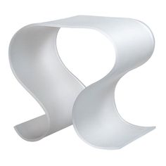 an abstract white sculpture with curved edges on a white background, it appears to be in the shape of a letter s