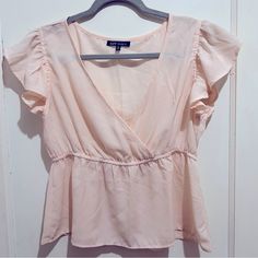 Here Is A Women’s Large Ballet Pink Flutter Sleeve Blouse By New Glory. It Is Super Cute And Feminine! Lightweight And In Brand New Looking Condition.. Perfect For Spring 2024! Measurements Taken Flat Across The Front: Bust: 16” But Has Stretchy Elastic Total Length: 24” Thanks For Looking! Check Out My Closet! I’m Posting A Ton Of New Stuff. Make An Offer. Almost All Offer Are Accepted! Pink Flutter Sleeve Tops For The Beach, Summer Pink Flutter Sleeve Tops, Pink Fitted Top With Flutter Sleeves, Playful Pink Flutter Sleeve Tops, Pink Cotton Top With 3/4 Sleeves, White Sleeveless Blouse, White Lace Blouse, Spring Boho, Tennis Shirts