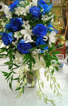 a vase filled with blue and white flowers