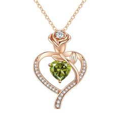 a heart shaped pendant with diamonds in the shape of a trell, on a gold chain