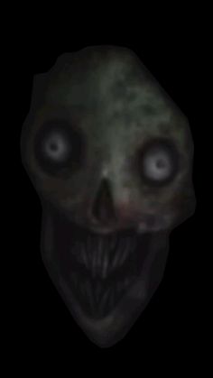 an alien head with glowing eyes in the dark