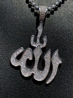 "Iced Out Men's Allah pendant Solid 925 sterling silver Micropaved with 1ct simulated diamonds (cz) This is the real stuff that doesn't change color or tarnish...this is solid silver not plated or filled You can purchase the pendant alone or with a 2.5mm diamond cut ball moon chain available 18-30\"....IF YOU WANT THE PENDANT ONLY, PLEASE SELECT \"0\" CHAIN. Pendant weighs 8 grams! Pendant and chain is 22-30 grams depending on length of chain Pendant is medium sized and is roughly 1.5'' by 1.5'' Iced Out Silver Jewelry For Anniversary, Engraved Silver Cubic Zirconia Jewelry, Silver Iced Out Jewelry For Anniversary, Silver Engraved Cubic Zirconia Jewelry, Silver Jewelry For Streetwear, White Bling Jewelry For Streetwear, Classic Iced Out Silver Jewelry, White Engraved Cubic Zirconia Jewelry, Silver Sterling Silver Jewelry For Streetwear