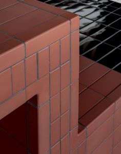 a close up of a red brick wall