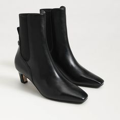 The Margo bootie is sophisticated and snappy featuring an elastic gore and sculpted heel. For a elevated touch, style Margo with a flowy skirt and structured blazer.. Heel Height: 2 inches. Toe: Pointed Toe. Boot Shaft: 6.6 inches. Calf Circumference: 9.8 inches. Material: Leather. Insole: Synthetic. Timeless Boots, Structured Blazer, Black Gloss, Flowy Skirt, Kitten Heel, Sam Edelman, Modern Luxury, Ankle Booties, Women's Boots