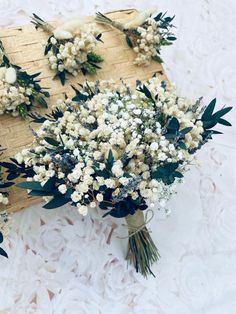 a bunch of flowers sitting on top of a table