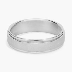 a white gold wedding ring on a white background