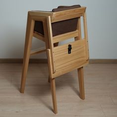 a wooden chair that is sitting on the floor