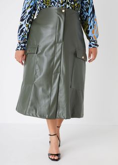 Make a statement in our faux leather cargo skirt! A daring front slit matched with a trendy midaxi length, this skirt is all about edgy style with a playful twist. Leather Skirt Midi, Midi Cargo Skirt, Midi Skirt Plus Size, Plus Size Cargo, Vegan Leather Skirt, Plus Size Fall Fashion, Skirt Plus Size, Plus Size Fall, Edgy Style