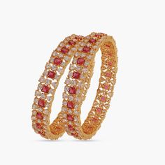 Description: Inspired by elegance, the Satina bangles offers a unique blend of luxury and style. The sensational design allows the bangles to appear lovely from every angle. The use of gold plating with the marvelous CZ stones creates an unforgettable jewelry piece at your fingertips. Details & Specifications: Materials used: CZ stones with Gold Plated Brass Weight - 2.4 - 42 gm, 2.6 - 42 gm, 2.8 - 47 gm Length - 2.4 - 5.5 cm, 2.6 - 6 cm, 2.8 - 6.5 cm Make it custom Want to make it a custom bang Cz Bangles, Bangles And Bracelets, Custom Bangle, Indian Bangles, The Bangles, Bangles Indian, Bangles Bracelets, Cz Stone, Jewelry Trends